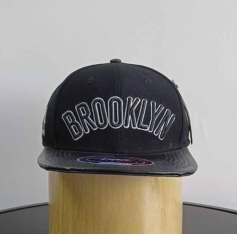 Daewen# snapback cap with faux leather brim and embroidery